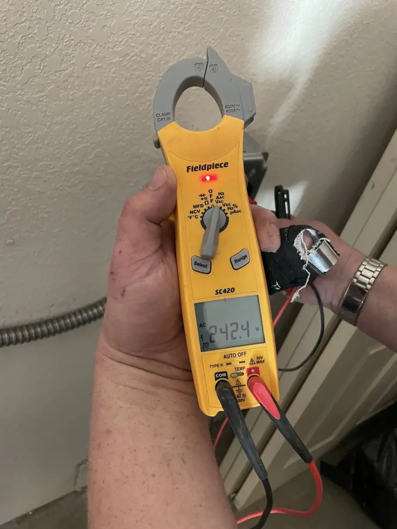 Voltage testing with clamp meter during Recessed Lighting Installation in Donaldsonville